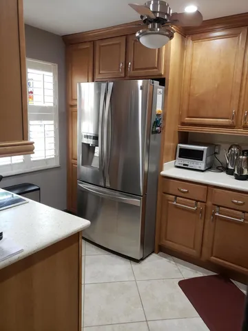 a kitchen with stainless steel appliances a sink a stove and a microwave