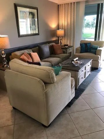 a living room with furniture and a window