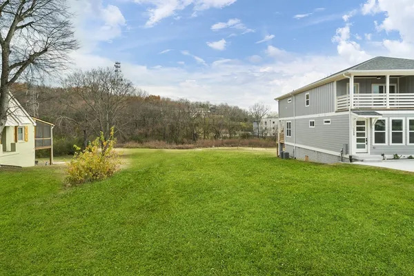 a backyard of a house with lots of green space