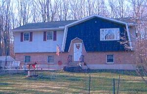3527 Williams Road Cresco, PA 18326 - Photo 1 of 1 a front view of a house with garden