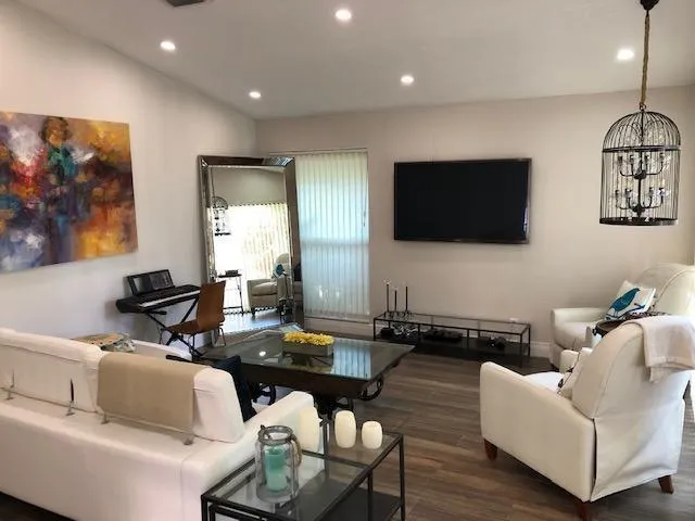 a living room with furniture and a flat screen tv