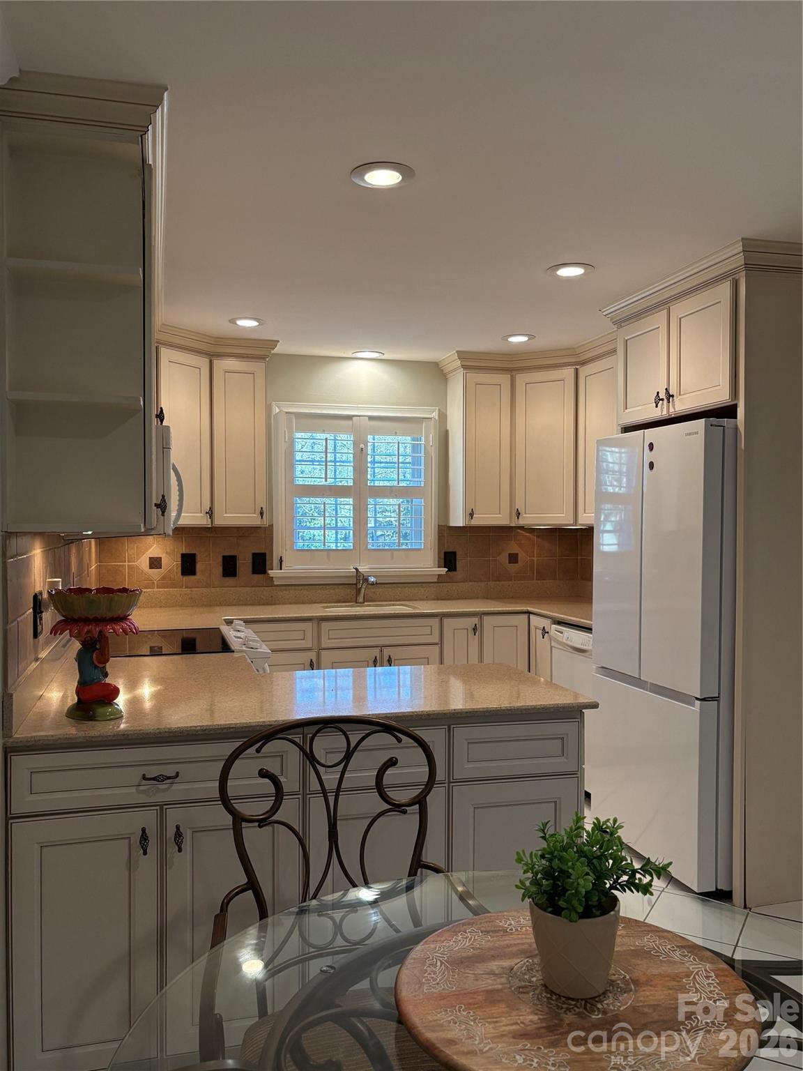 2800 Spring Valley Road Charlotte, NC 28210 - Photo 11 of 31 a kitchen with stainless steel appliances granite countertop a refrigerator and a sink