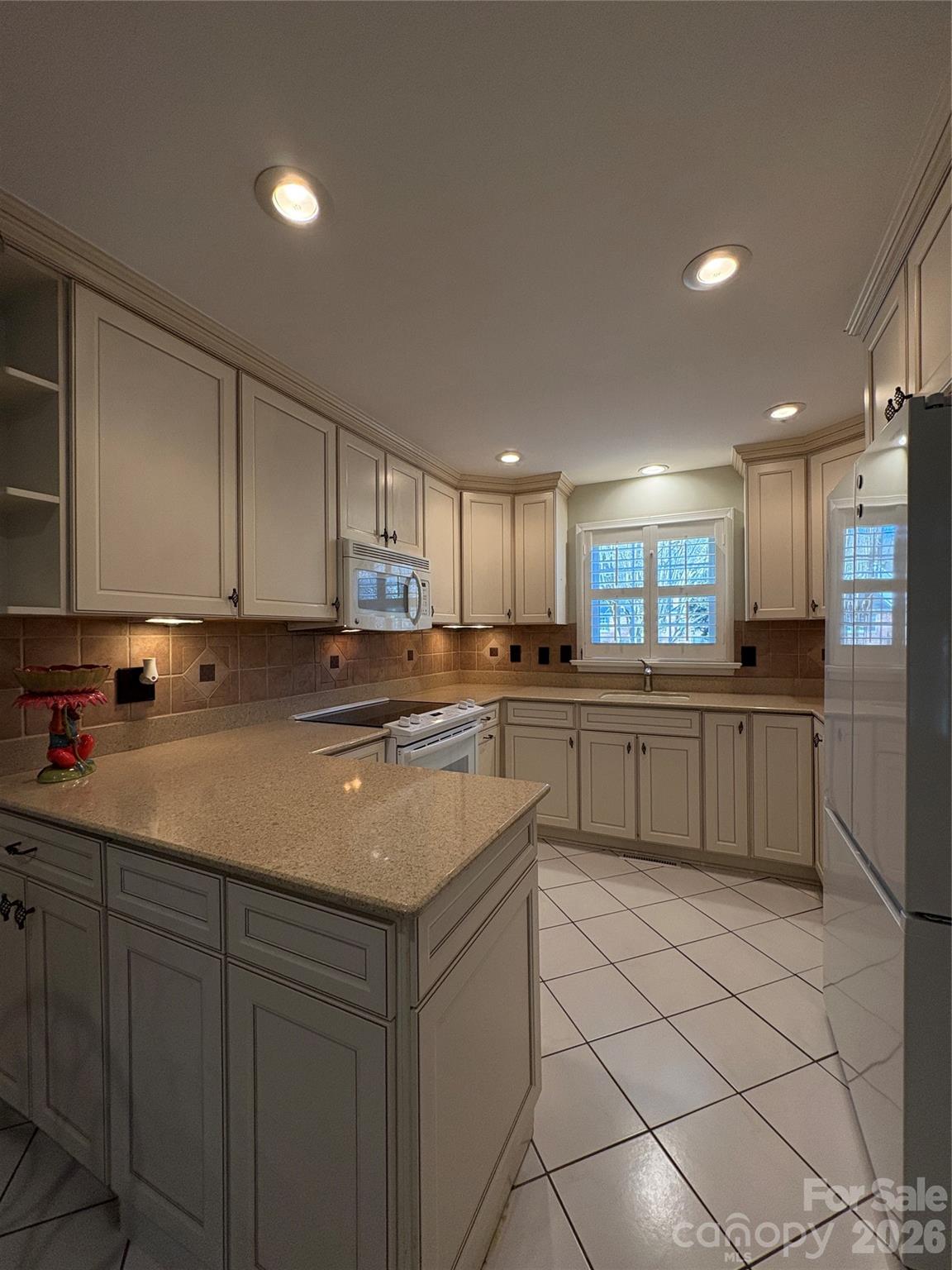 2800 Spring Valley Road Charlotte, NC 28210 - Photo 12 of 31 a kitchen with stainless steel appliances granite countertop a sink and a stove
