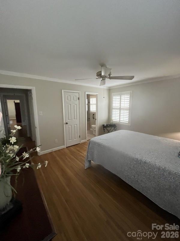 2800 Spring Valley Road Charlotte, NC 28210 - Photo 16 of 31 a bedroom with a bed and lamp on dresser