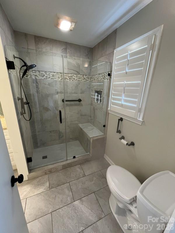 2800 Spring Valley Road Charlotte, NC 28210 - Photo 17 of 31 a bathroom with a toilet and a shower