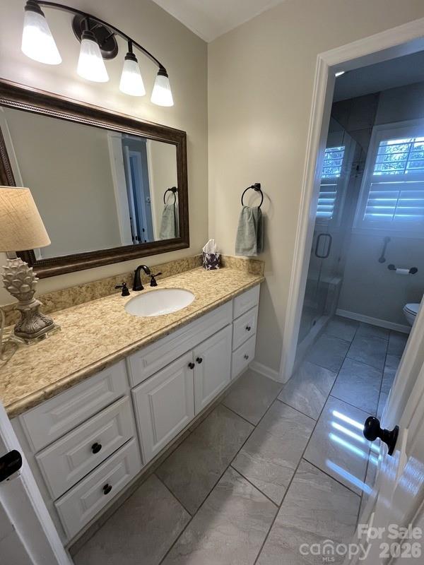 2800 Spring Valley Road Charlotte, NC 28210 - Photo 18 of 31 a bathroom with a granite countertop sink and a mirror