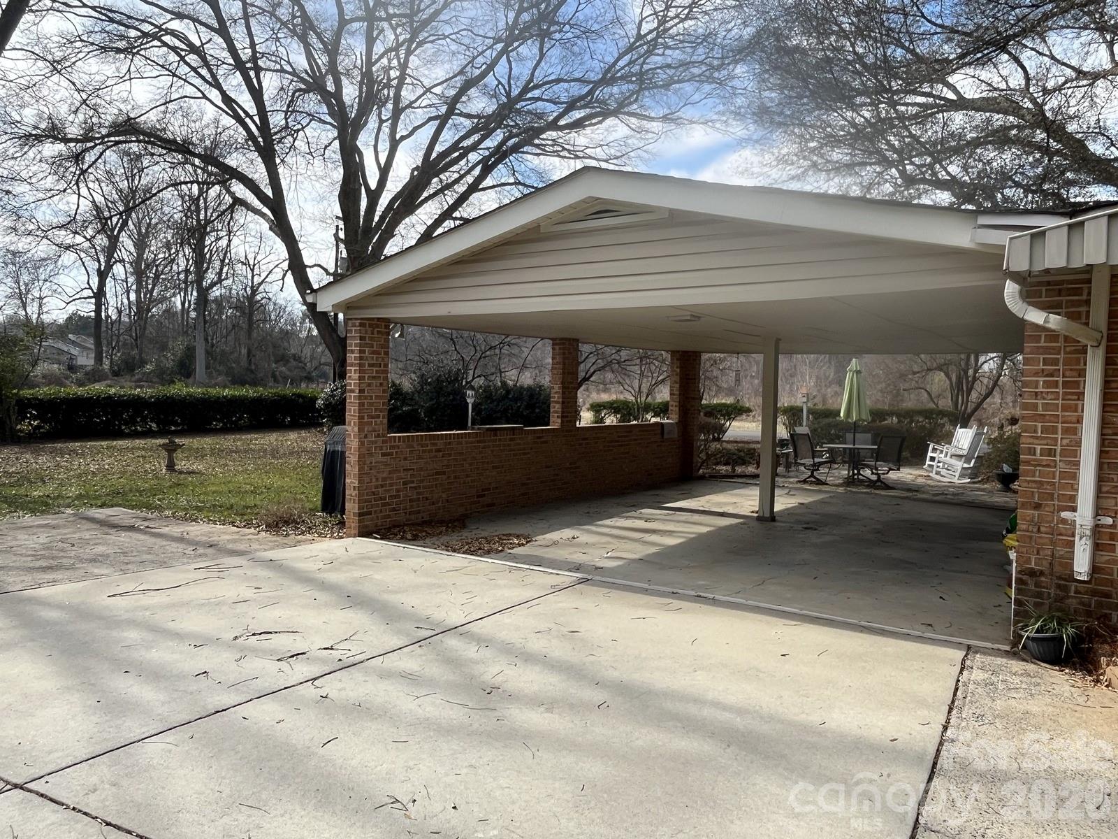 2800 Spring Valley Road Charlotte, NC 28210 - Photo 26 of 31 a view of parking garage with a yard