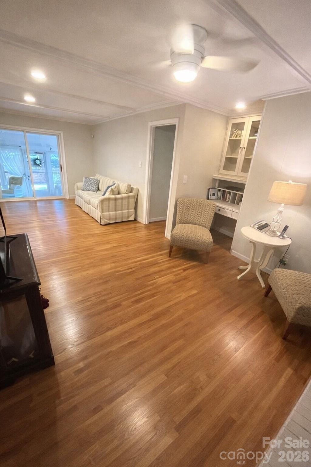 2800 Spring Valley Road Charlotte, NC 28210 - Photo 5 of 31 a room with wooden floor and furniture