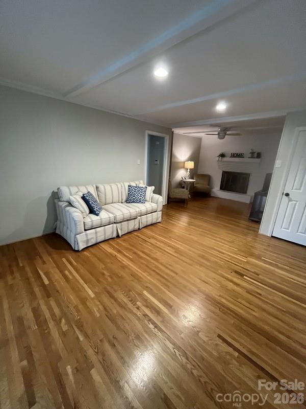 2800 Spring Valley Road Charlotte, NC 28210 - Photo 7 of 31 a living room with furniture and a fireplace