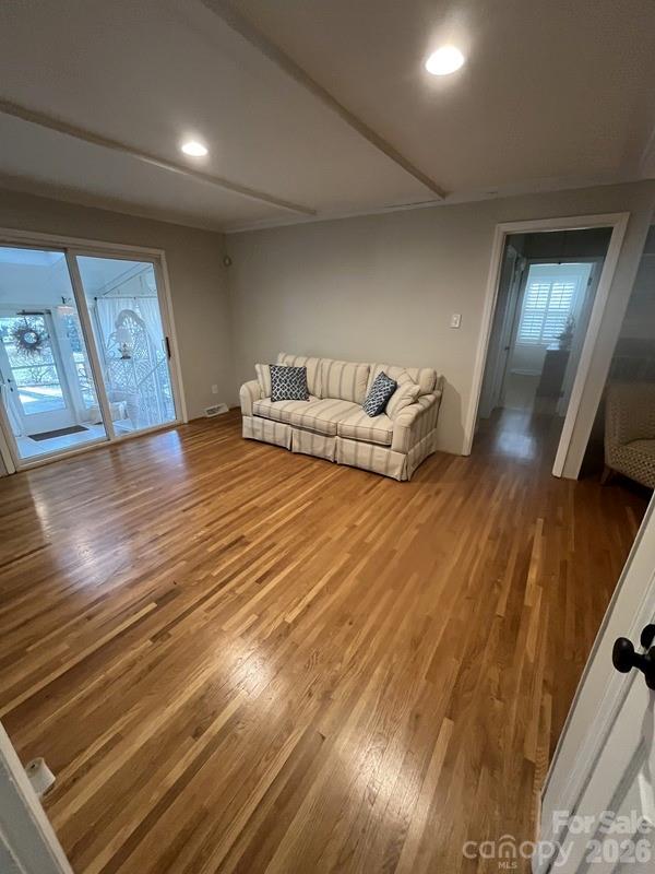 2800 Spring Valley Road Charlotte, NC 28210 - Photo 9 of 31 a spacious bedroom with a bed and wooden floor