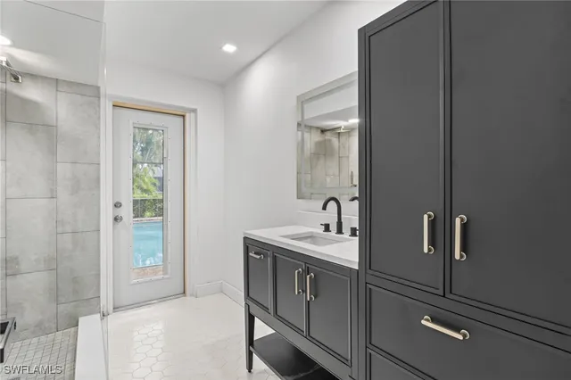 a bathroom with a sink and a mirror