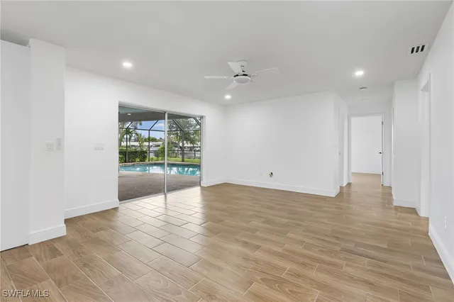 a view of an empty room with a window