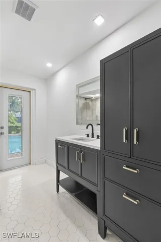 a bathroom with a sink and a mirror