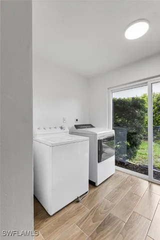 a utility room with dryer and washer