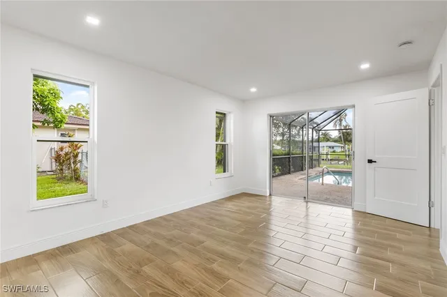 a view of an empty room and window