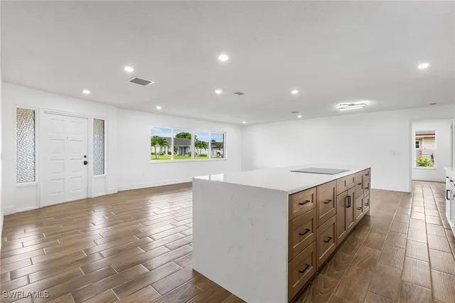 a kitchen with stainless steel appliances granite countertop a stove and a sink