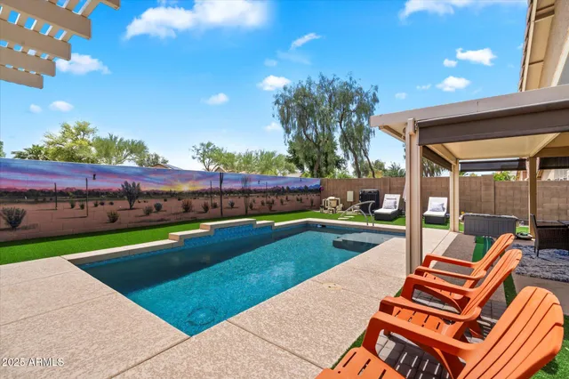 a view of a patio with swimming pool