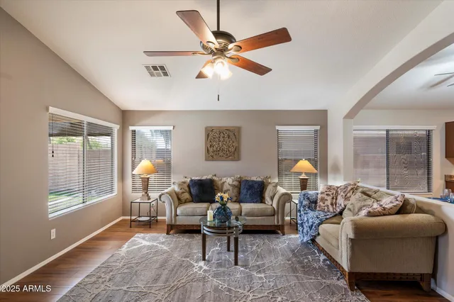 a living room with furniture and a window