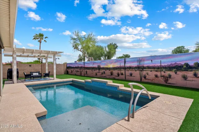 a view of a swimming pool with a lawn chairs
