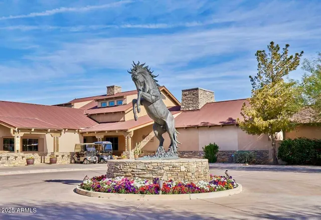 a view of a street with cars parked in front of it