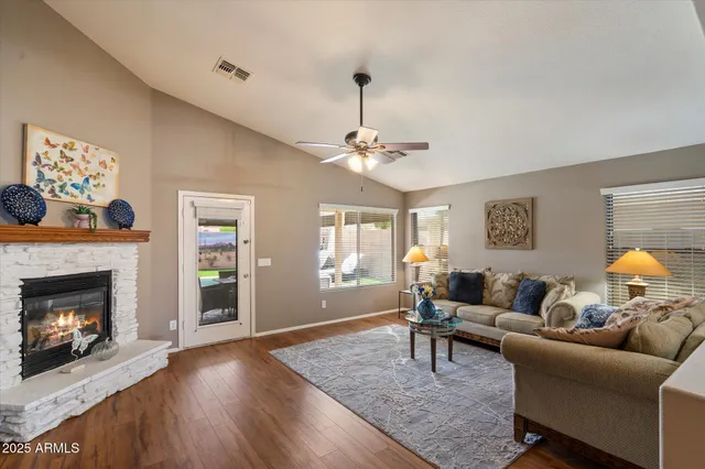 a living room with furniture and a fireplace