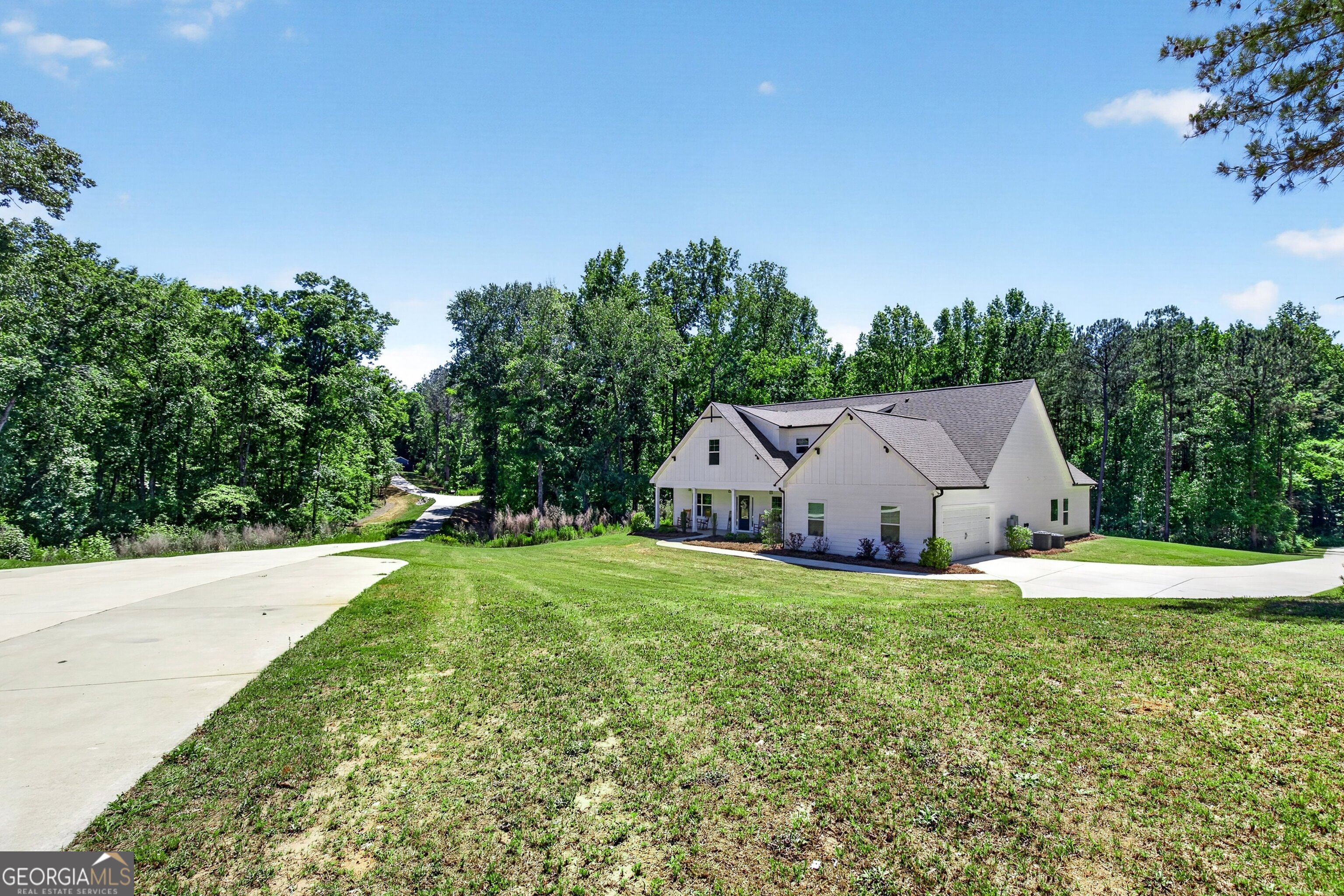 1764 Luther Bailey Road Senoia, GA 30276 - Photo 46 of 63 a house with green field in front of it