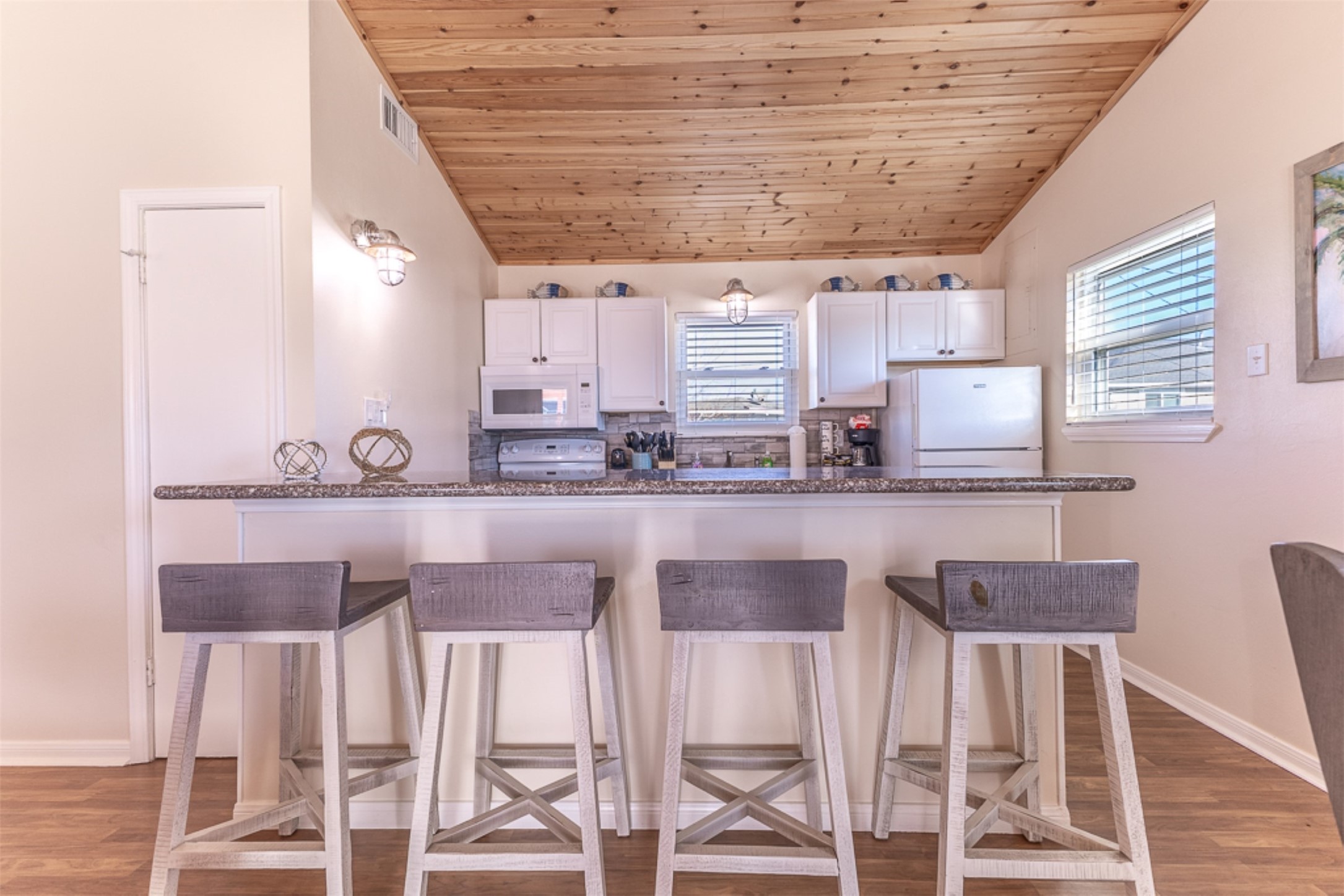 16618 Jean Lafitte Road Jamaica Beach, TX 77554 - Photo 14 of 47 a kitchen with a sink cabinets and wooden floor