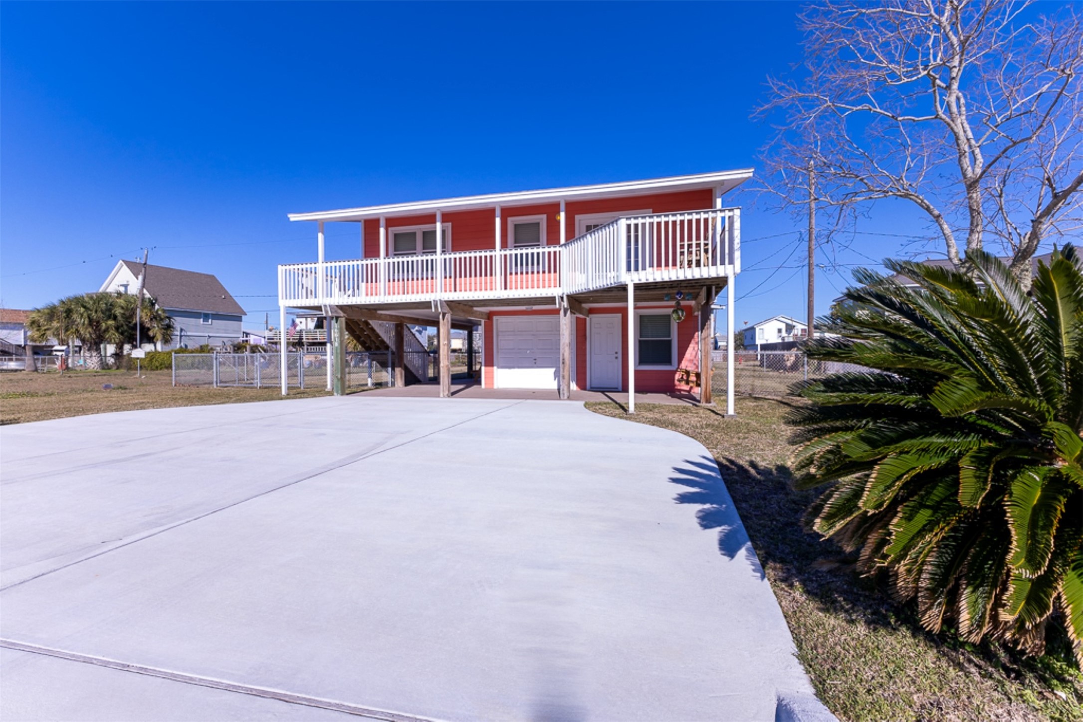 16618 Jean Lafitte Road Jamaica Beach, TX 77554 - Photo 35 of 47 a view of a house with a patio