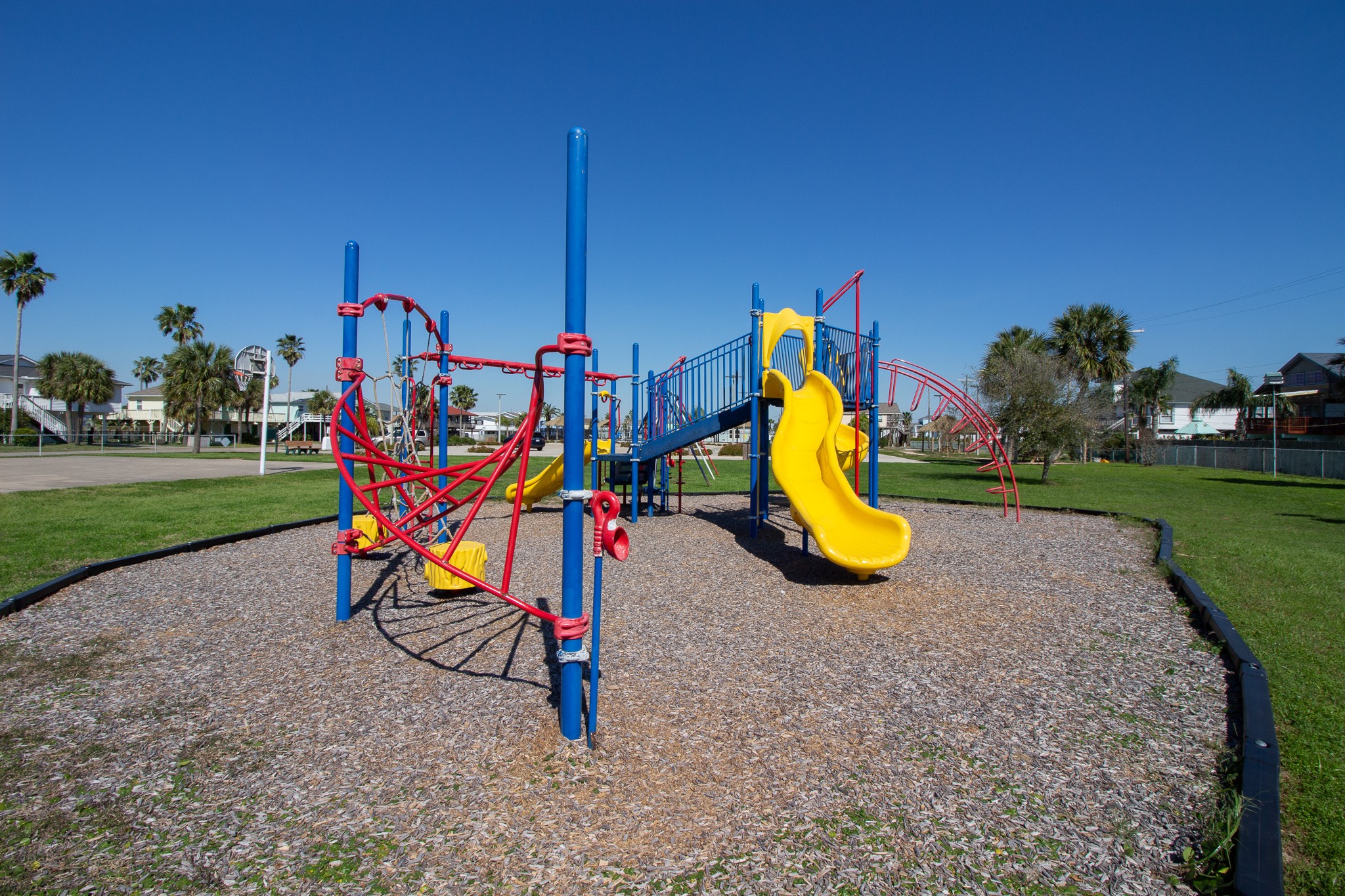 16618 Jean Lafitte Road Jamaica Beach, TX 77554 - Photo 46 of 47 a view of a park with swings and slides