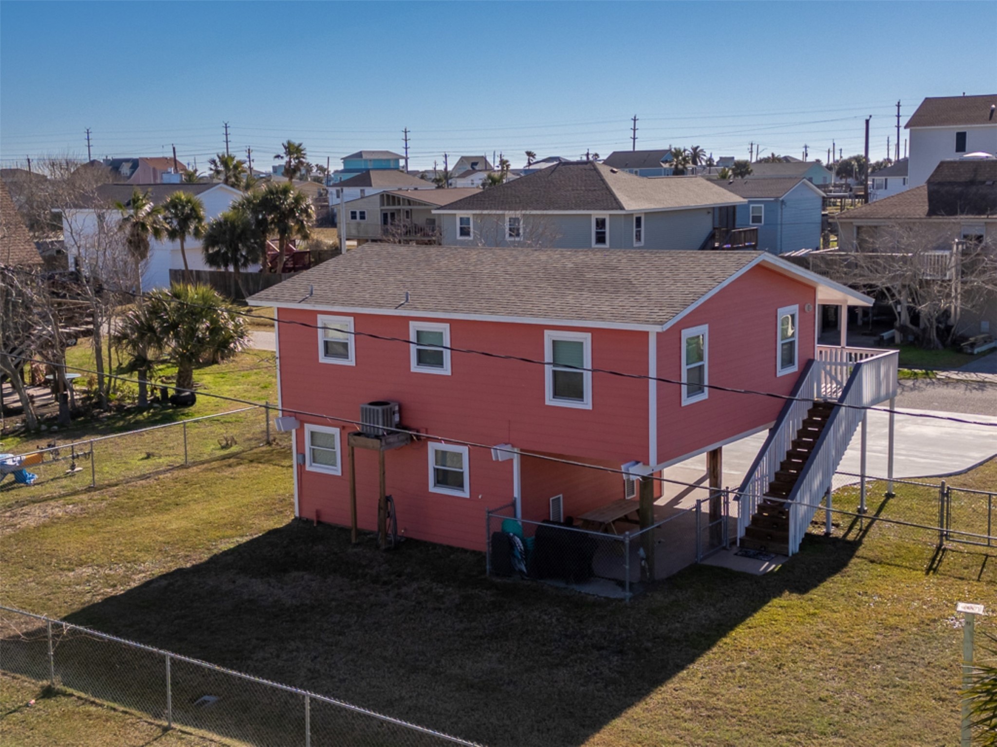 16618 Jean Lafitte Road Jamaica Beach, TX 77554 - Photo 6 of 47 a front view of a house with a yard