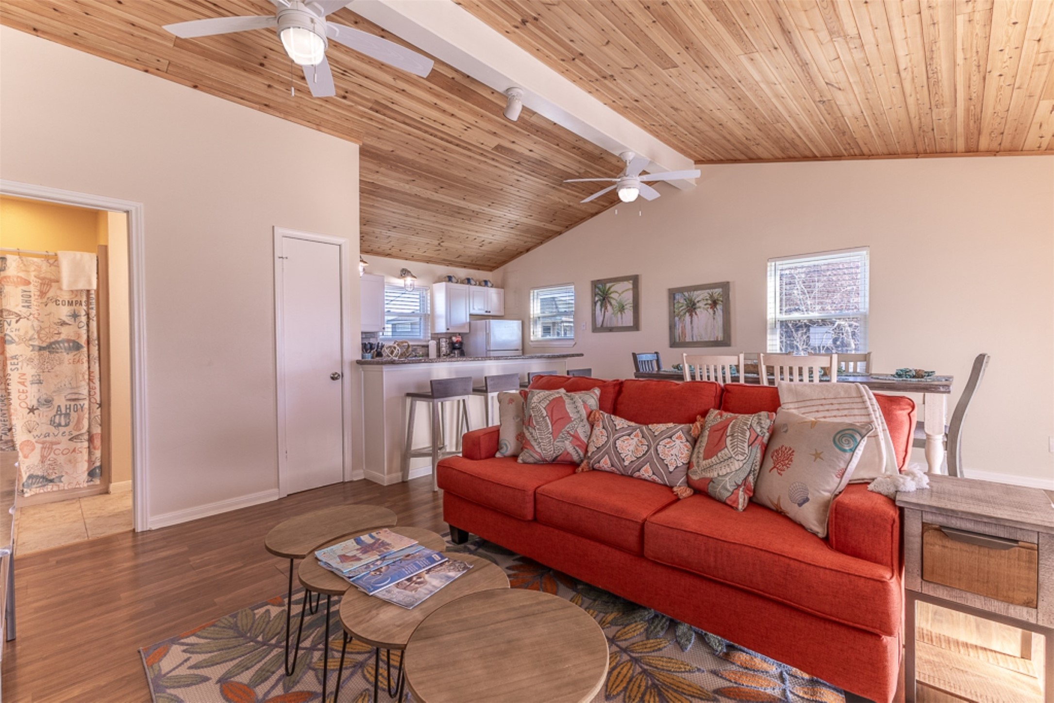 16618 Jean Lafitte Road Jamaica Beach, TX 77554 - Photo 10 of 47 a living room with furniture a wooden floor and next to a window