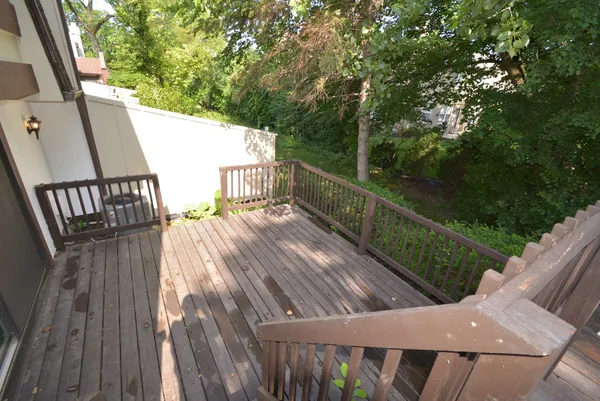 a balcony with wooden floor