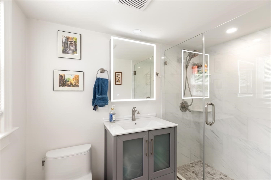 155 Adams Avenue Newton, MA 02465 - Photo 30 of 37 a bathroom with a sink a toilet and shower