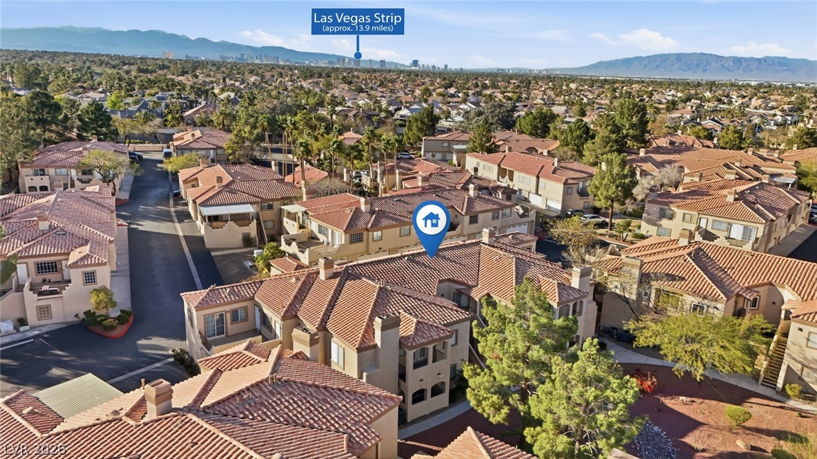 Aerial view of residential area featuring a mountain backdrop