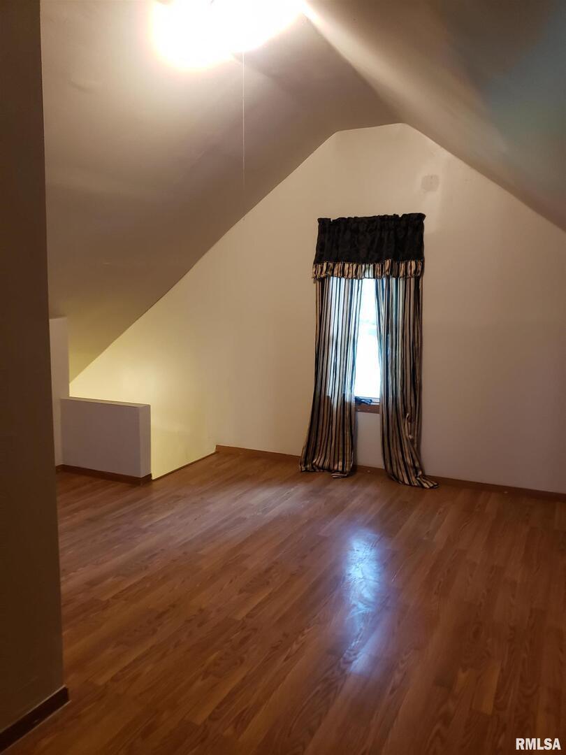 212 44th Street Moline, IL 61265 - Photo 11 of 23 an empty room with wooden floor and windows