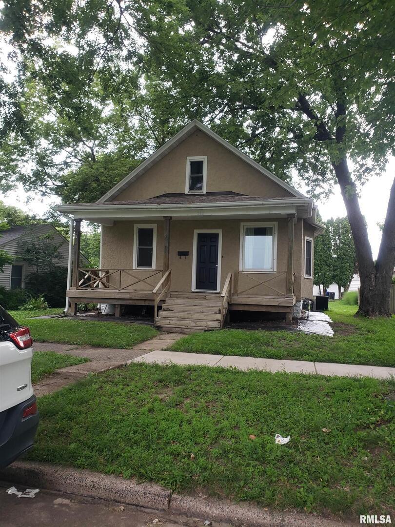 212 44th Street Moline, IL 61265 - Photo 23 of 23 a front view of a house with a garden
