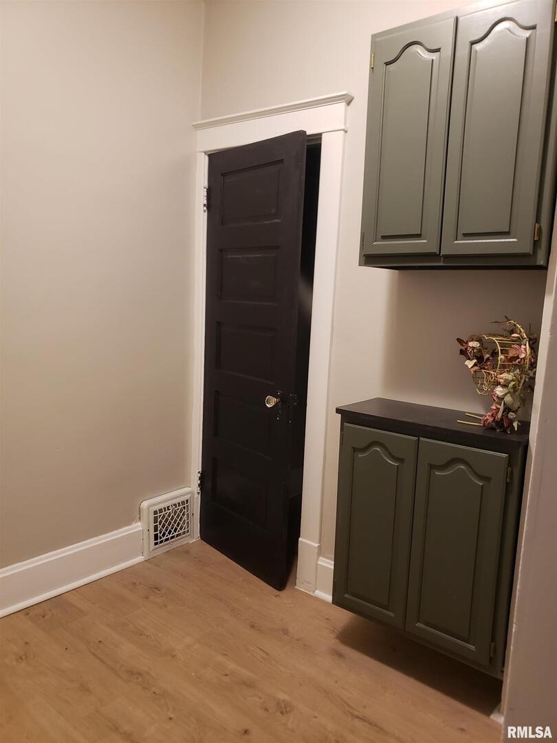 212 44th Street Moline, IL 61265 - Photo 7 of 23 a kitchen with a refrigerator and cabinets