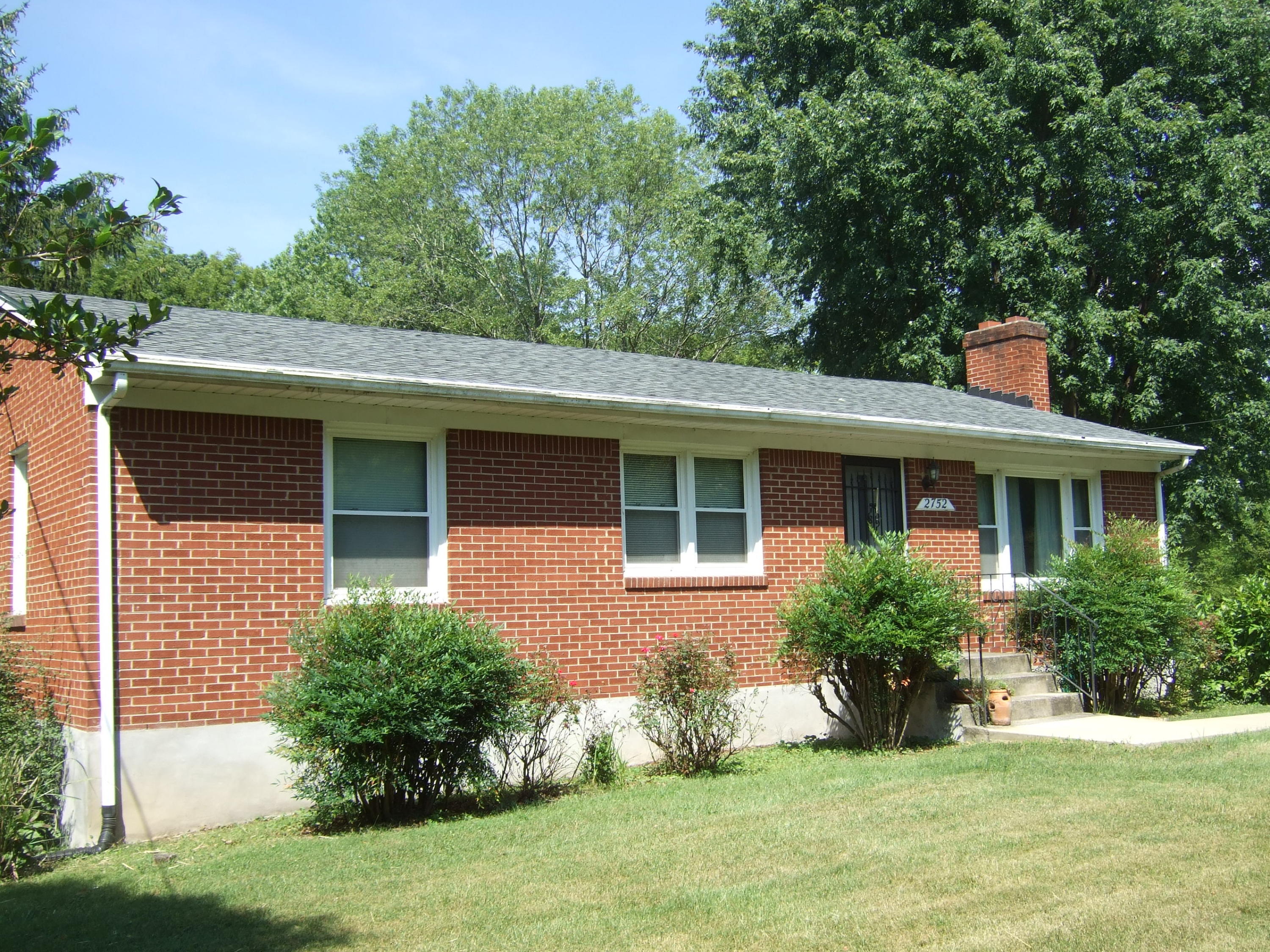 2752 Green Ridge Road Roanoke, VA 24019 - Photo 1 of 17 a front view of a house with a yard