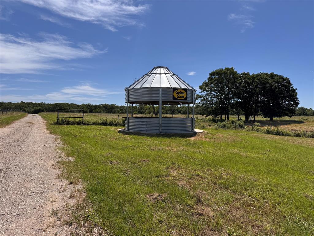 1411 Rains County Road 2610 Alba, TX 75410 - Photo 14 of 25 a swimming pool with outdoor seating and garden
