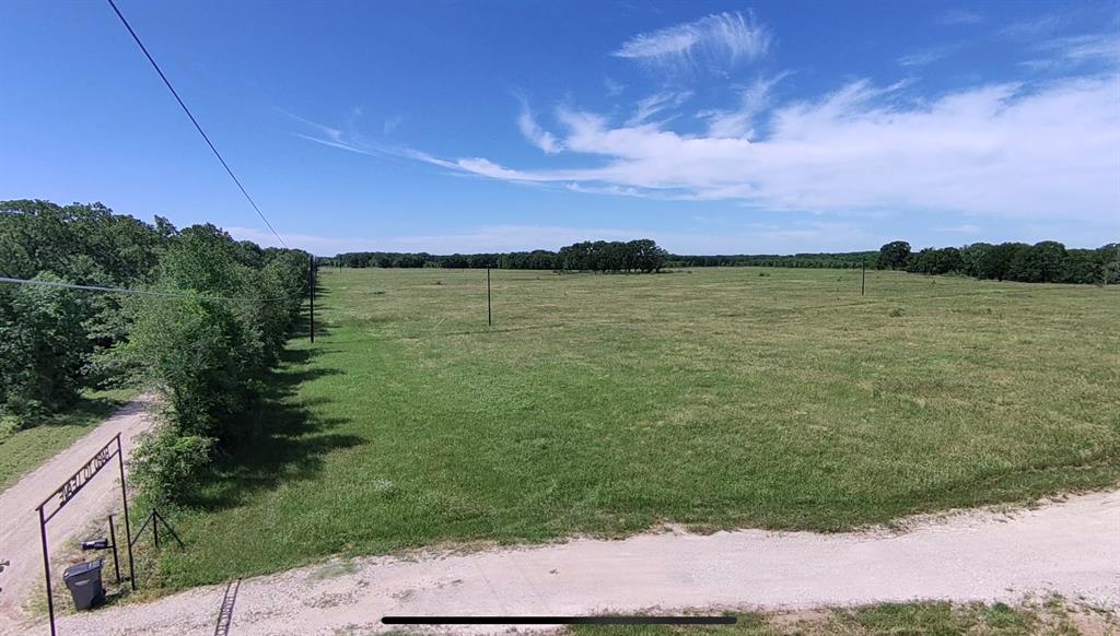 1411 Rains County Road 2610 Alba, TX 75410 - Photo 18 of 25 a view of a lake from a yard