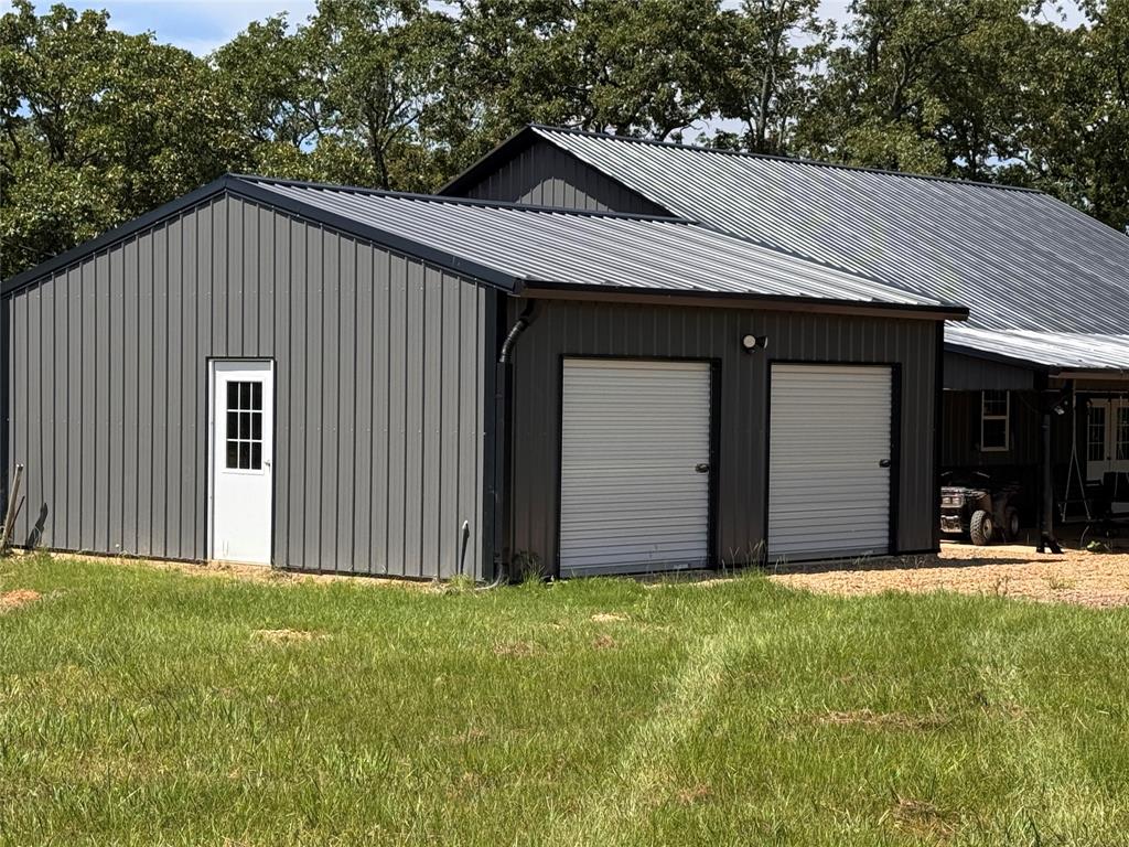 1411 Rains County Road 2610 Alba, TX 75410 - Photo 3 of 25 a view of a house with yard and garage