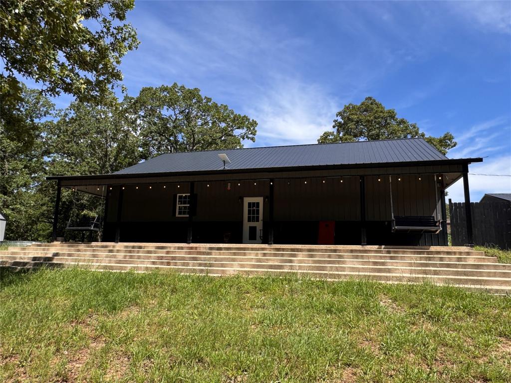 1411 Rains County Road 2610 Alba, TX 75410 - Photo 4 of 25 a backyard of a house with lots of green space