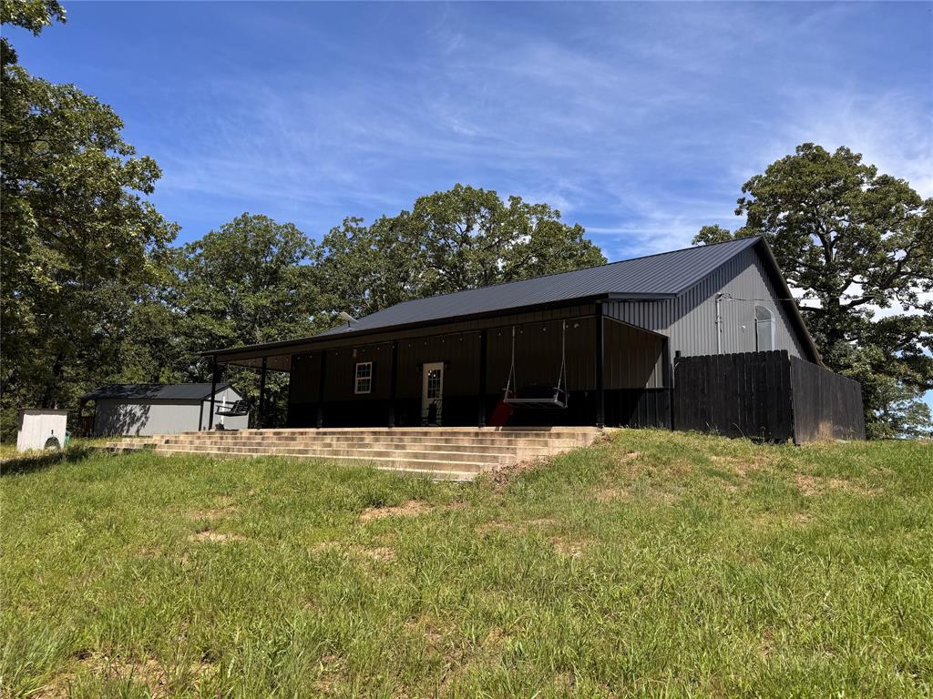 1411 Rains County Road 2610 Alba, TX 75410 - Photo 5 of 25 a house view with a garden space