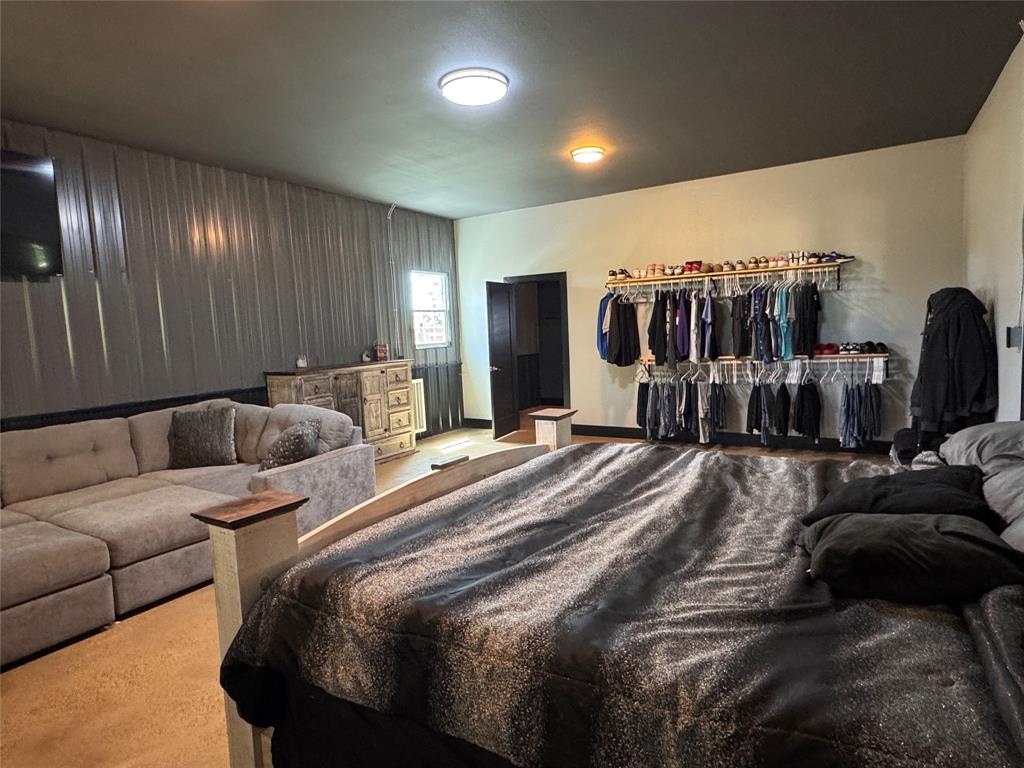 1411 Rains County Road 2610 Alba, TX 75410 - Photo 8 of 25 a spacious bedroom with a bed and walk in closet