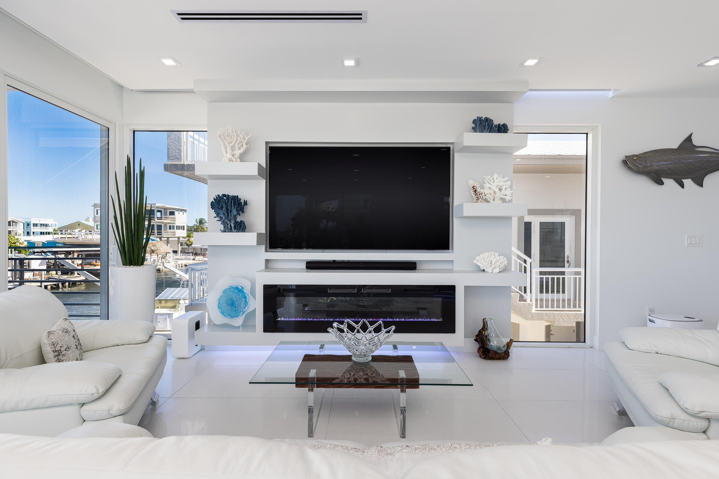 45 Cormorant Drive Key Largo, FL 33037 - Photo 13 of 51 a living room with furniture and a flat screen tv