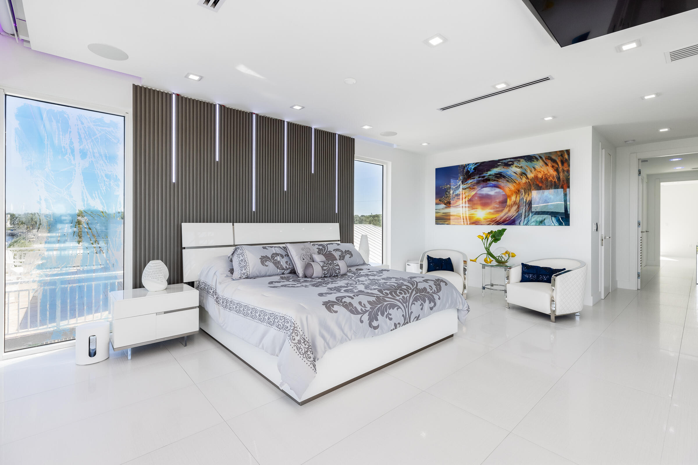 45 Cormorant Drive Key Largo, FL 33037 - Photo 18 of 51 a spacious bedroom with a bed and a couch