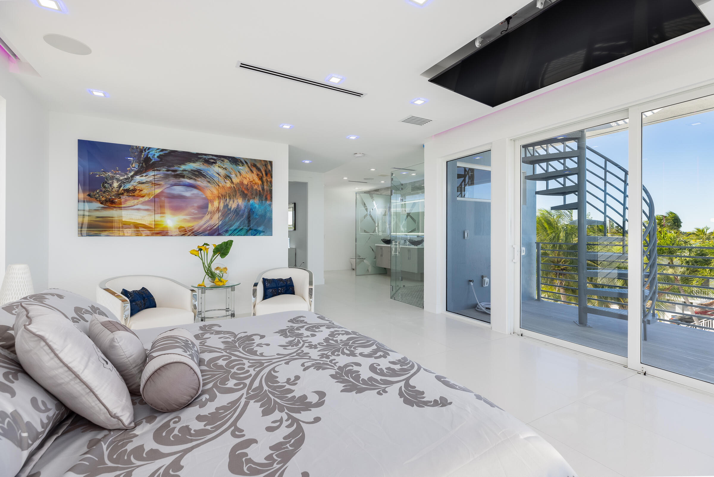 45 Cormorant Drive Key Largo, FL 33037 - Photo 19 of 51 a living room with furniture a flat screen tv and a floor to ceiling window