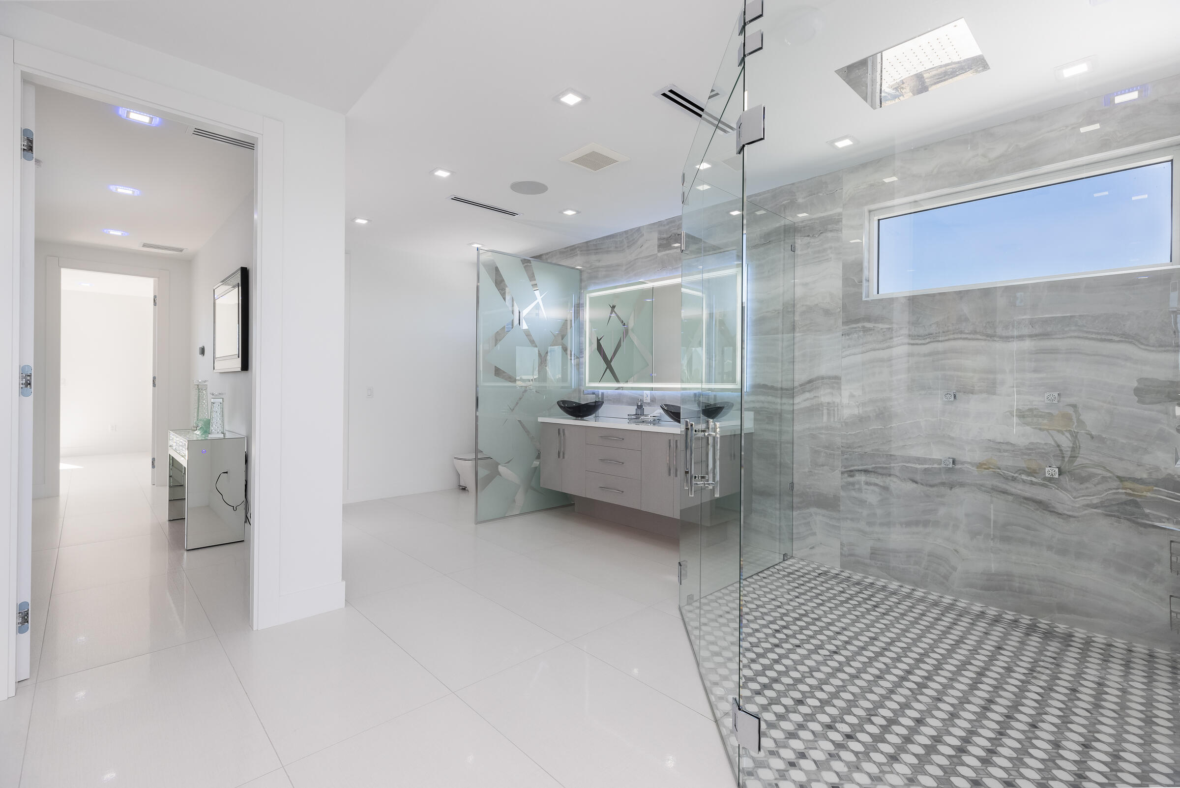 45 Cormorant Drive Key Largo, FL 33037 - Photo 21 of 51 a bathroom with a sink a mirror and a shower