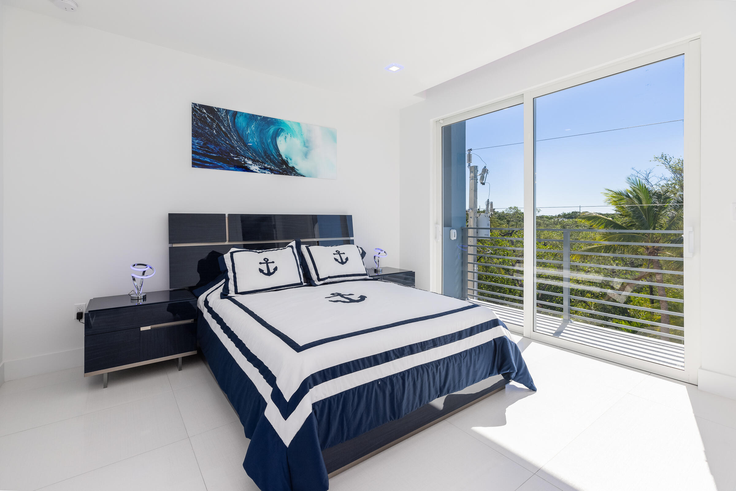 45 Cormorant Drive Key Largo, FL 33037 - Photo 28 of 51 a bed sitting in a bedroom next to a window