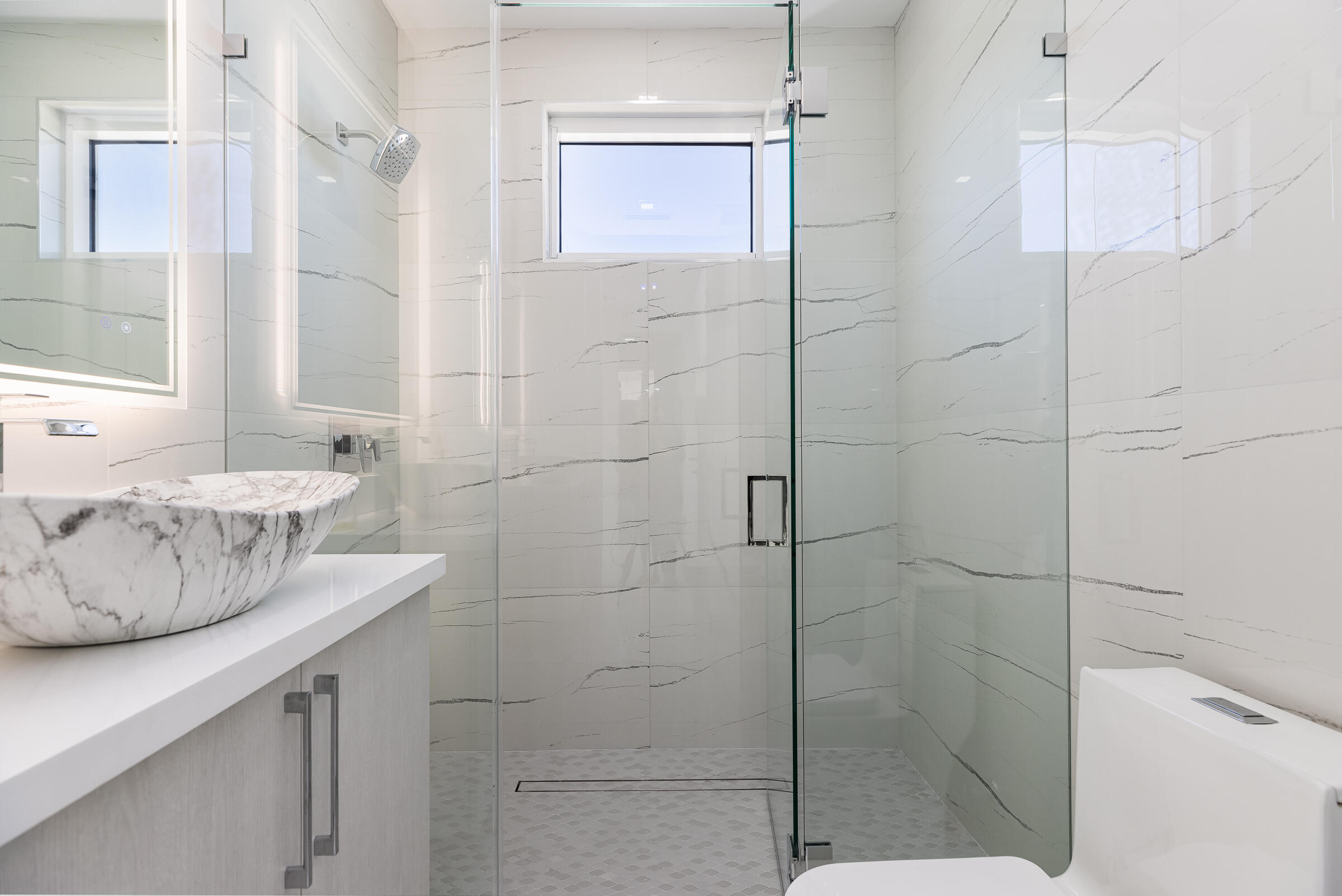 45 Cormorant Drive Key Largo, FL 33037 - Photo 31 of 51 a bathroom with a granite countertop shower a sink and a shower